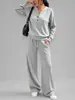 Conjunto deportivo casual de dos piezas para mujer, otoño e invierno 2026, transfronterizo europeo y americano, nuevo diseño de moda, top holgado de manga larga y pantalón de pierna ancha
