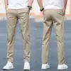 Pantalones casuales de verano nuevos, pantalones para hombre estilo K, pantalones modernos holgados de pierna recta para jóvenes, de algodón puro elástico color blanco hueso para hombre