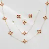 Conjunto de joyería de cuatro hojas con incrustaciones de diamantes, diseño de nicho, estilo largo, superventas transfronterizo para mujer: collar, anillo, pendientes, pulsera