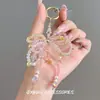 Pingente de Corrente para Celular com Miçangas de Cristal e Laço Criativo e Fashion, Design Delicado e Doce, Pingente de Laço Versátil