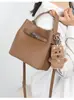 Bolso de Mano Nuevo de Nicho para Mujer Otoño/Invierno 2026 Bolso de Hombro Vintage de Gama Alta para el Trabajo y los Viajes Diarios Bolso Cruzado tipo Cubo
