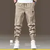 Pantalones de trabajo para hombre, colección de otoño, corte regular, modernos, holgados, tobillos cónicos, estilo coreano, versátiles, adelgazantes, deportivos, pantalones casuales