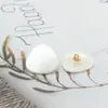 Suministro directo de fábrica botón de resina de dos ojales Triángulo Cuadrado forma de concha imitación hebilla para abrigo de mujer cortavientos abrigo de cuero en stock
