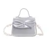 Nueva Bolsa Transfronteriza para Niños, Bolso de Hombro Simple de Color Sólido Estilo Coreano para Niños y Niñas, Lindo Bolso con Lazo y Cadena de Perlas