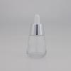Botella de vidrio con gotero de 50 ml subenvasada de fondo grueso plateado de aspecto agradable de alta gama transparente botella de aceite esencial de 30 ml botella desnuda