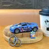 Chaveiro de Carro Esportivo com Puxar e Portas Duplas Transfronteiriças com Grafite Brinquedo Modelo de Corrida Divertido Pingente Acessório para Mochila de Estudante