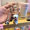 Novo chaveiro de desenho animado do Snoopy pingente de bolsa de casal chaveiro de carro boneca de borracha macia pequeno presente atacado