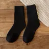 Calcetines de rizo para hombre y mujer calcetines de invierno engrosados de longitud media calcetines de anillo de lana calcetines de mujer color liso calcetines cálidos de toalla venta al por mayor