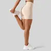 Pantalones cortos de yoga de cintura alta sin línea T, ajustados, de cinco puntos, para fitness y deportes de color melocotón