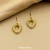 Pendientes Largos Huecos con Forma de Corazón de Zirconia Chapados en Oro Estilo Europeo y Americano para Mujer, Versátiles y de Alta Gama, Pendientes de Aro Huecos Más Vendidos Transfronterizos