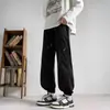 Moda outono masculina, calças jogger versáteis estilosas e únicas no estilo de Hong Kong para homens e adolescentes, calças cargo casuais largas e da moda