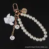 Llavero de Aleación con Colgante de Ángel de Perla Estilo Japonés Colgante para Funda de AirPods Accesorio para Bolso de Estudiante