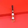 Se puede hacer tú mismo con cuerda roja creativa, cinco monedas de emperador, accesorios semiacabados para llaveros, accesorios para bolsos, colgante para coche, generación