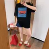 Camiseta casual de manga corta con estampado de dibujos animados de Dongdaemun, Corea, para mujer, diseño versátil de verano, corte holgado, top de algodón puro, moderno