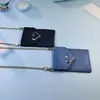 2022 nueva hebilla de amor cartera cruzada diagonal bolsa para teléfono móvil paquete de tarjetas de autobús INS Red social bolsa para carcasa de teléfono