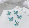 Accesorios metálicos para decoración de uñas de ojo de gato mariposa de circonita, decoración de uñas de aleación de rhinestone tridimensional súper brillante, colores oro y plata con goteo de aceite