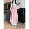 Nueva colección de otoño e invierno: falda larga de punto de corte holgado y estilo relajado, versátil y fácil de combinar, diseño estilo coreano para otoño e invierno con doble bolsillo
