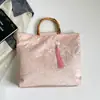 Bolso de mano tejido de lino y bambú transfronterizo nuevo, colección otoño 2026, con estilo chino moderno, diseñado como bolso de noche para mujer