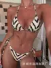 Suministro exclusivo de comercio electrónico transfronterizo desde la fábrica, al por mayor directo en stock de conjunto de bikini de rayas de cebra para mujer, casual y elegante, con abertura alta