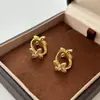 Pendientes de Flor de Cuatro Hojas Doble Cara 2026 Nuevo Estilo Popular Lujo Ligero Gama Alta Exquisitos Pendientes de Circonita Pendientes de Estilo Nicho