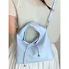 Bolsa Feminina Tendência 2026 Primavera Novo Estilo Fashion e Única Casual Ombro Transversal Texturizada Tendência Bolsinha de Axila para Mulheres
