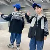Ropa para Niños Chaqueta Cortavientos con Capucha para Niños Primavera y Otoño Niños Grandes Casual de Primavera Holgada Resistente al Viento Superior Moderna Venta al por Mayor Transfronterizo