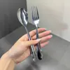 Fuente Transfronteriza Acero Inoxidable 410 Mango Curvo Pulido Serie Juego de Cubiertos Occidentales Tenedor Cuchara Uso Comercial Venta Exclusiva en Centro Comercial