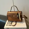 Bolsa de Mão de Nicho de Alto Valor Estilo Coreano 2025 Inverno Nova Tendência Moda Casual Feminina Bolsa de Mão e Bolsa Transversal