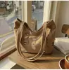 Bolsa de mano bordada estilo coreano al por mayor para mujer, nuevo modelo primavera 2026, bolso de hombro de gran capacidad, bolso casual para el antebrazo