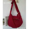 Bolsa de lona impermeável de nylon bolsa da moda tendência outono e inverno bolsa estilo Mori artístico estudante universitário classe ombro atacado