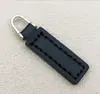 Herrajes para equipaje de ropa tirador de cuero colgante tirador de cremallera cola de tirador de cremallera tirador de cuero para cremallera fabricantes suministro