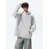 Sudadera de retazos de moda con corte relajado, con un diseño estilo americano, corte extragrande y una estética urbana genial.