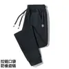 Calça casual masculina de bolso com zíper para primavera e outono, calça esportiva masculina elástica plus size solta e comprida