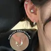 Aguja de Plata S925 Cuidado del Agujero de la Oreja Ear Cuff Aretes para Mujer Círculo Liso Hebilla de Oreja Mobius Pendientes 2026 Nuevos Accesorios de Oreja de Moda