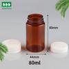 Botella de caramelo PET blanco de 80 ml de fábrica, botella para cápsulas, botella para pastillas sólidas, botella para el cuidado de la salud