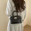 Bolsa tipo concha de alta gama para mujer 2026 Nueva moda Versátil Bolso de hombro cruzado con hebilla de cierre Bolso Kelly