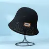 Venta al por mayor de fábrica sombrero de pescador de punto hueco de primavera y verano para mujer mostrar cara pequeño moda sombrero de cubo para el sol sombrero de protección solar transfronterizo