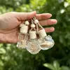 Botella ambientador para coche, accesorio colgante para coche, dispensador de perfume colgante para coche con cuerda y tapa de madera, botella de vidrio compacta