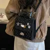 Moda de lunares estudiante universitario otoño e invierno mochila nuevo un solo hombro doble hombro 2026 niña de dibujos animados coreana de mano chica japonesa