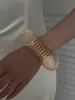 1 peça de pulseira elástica dourada em espiral com design vazado geométrico, estilo metal, acessório feminino moderno e de luxo leve