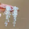 Pendientes de borlas de fuegos artificiales con fiebre para mujer, pendientes largos de personalidad retro súper blancos, pendientes de cuentas de alto sentido