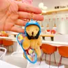 Novo Pingente de Pelúcia Urso de Skate Criativo Desenho Animado Fofo Chaveiro Estilo Vento Chaveiro para Mochila de Estudante