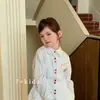 Ropa popular coreana Bokabo para niñas: conjunto de tres piezas para niños con protección solar (camisa + falda), primavera/verano/otoño 2026