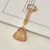 Llavero de bolso con incrustaciones de diamantes de arcilla transfronterizo, lleno de diamantes, accesorio de llavero de coche deslumbrante de alta gama