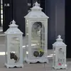 Estilo europeo hierro retro romántico adornos de candelabro lámpara de viento a prueba de viento de pie soporte para velas accesorios de boda linterna guía de camino