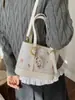 Bolsa Saco Estampada em Desenho Animado Transfronteiriça para Mulheres Moda Primavera/Verão 2026 Bolsa de Ombro de Luxo Tendência Casual Bolsa de Axila