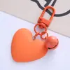 Nuevo llavero de color caramelo con forma de campana de amor, lindo para chica, corazón de chica, corazón de melocotón, funda para auriculares, colgante para bolso, en stock, venta al por mayor