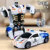 Coche de juguete de deformación para niños impacto inercial deformación con un botón coche de policía niño rompecabezas deformación por colisión Autobots venta al por mayor