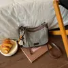 Bolsa tejida casual para mujer Shuai Mi Jia, nuevo estilo de otoño 2026, bolsa de paja, bolso de hombro y cruzado de moda nicho