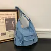 Bolsa de mezclilla casual de gran capacidad para mujer, nuevo modelo 2026, mochila para la ciudad, bolso de hombro y cruzado multiusos, moderno